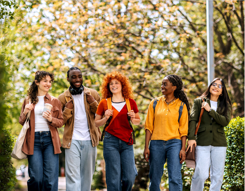 Students walking on a wooded campus path